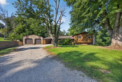COMMUNE WITH NATURE IN THIS TRI-LEVEL HOME.
